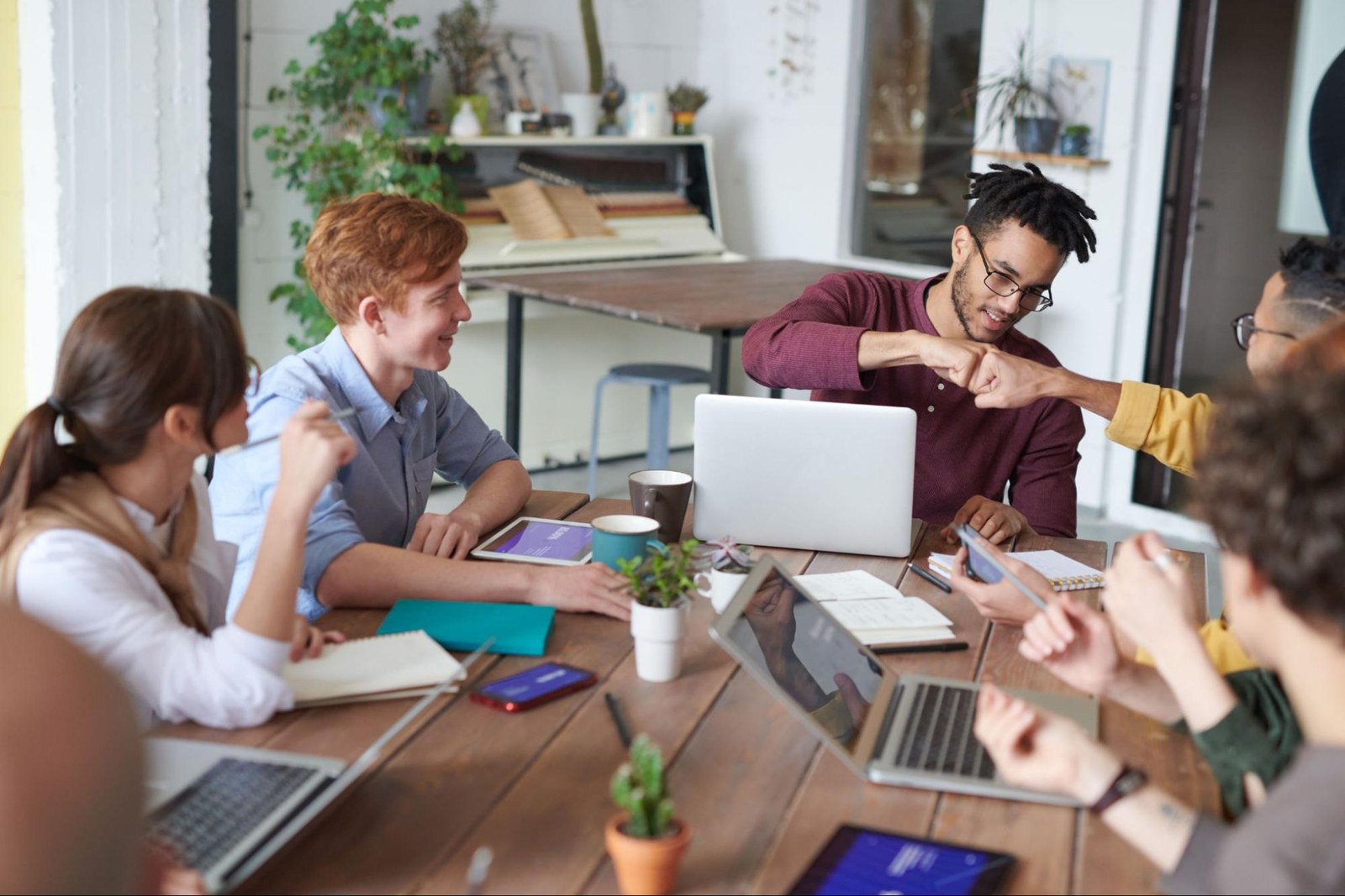 A small group of colleagues collaborating around a table